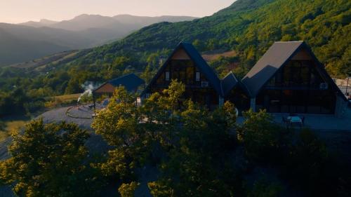an aerial view of a building with mountains in the background at Village Villas in Şamaxı