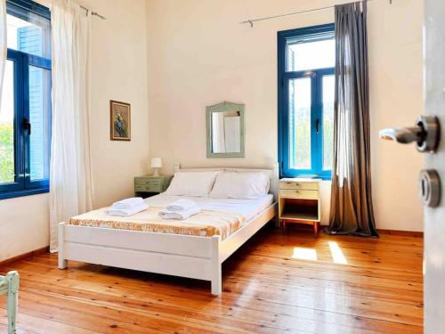 Ένα ή περισσότερα κρεβάτια σε δωμάτιο στο Villa Xanthippe