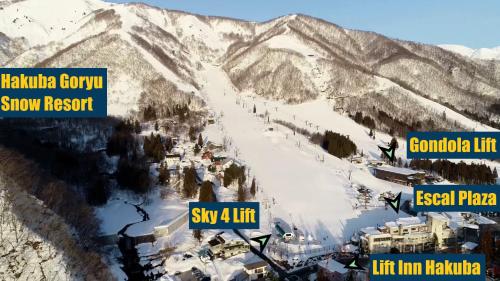 a view of a snow covered mountain with a ski resort at Lift Inn Hakuba Goryu in Hakuba
