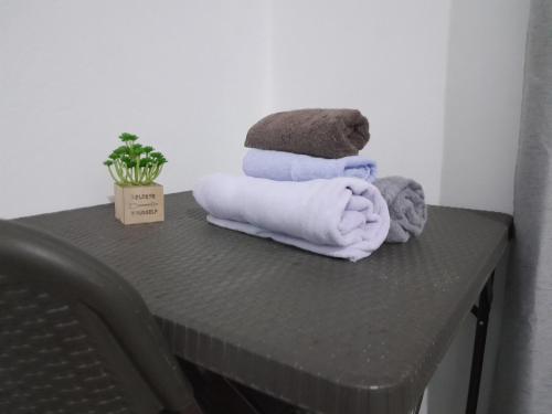 a table with towels on top of a table at Peace Hut in Nadi