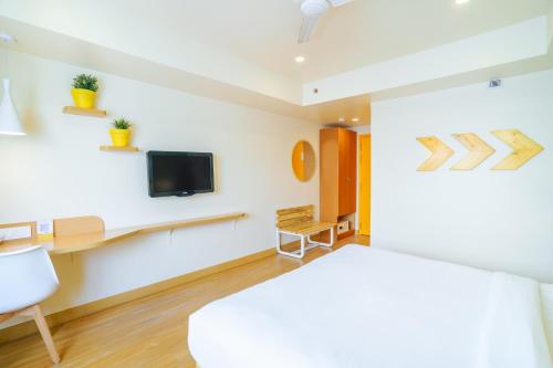 TV a/nebo společenská místnost v ubytování Bloom Hotel - Cyber Towers