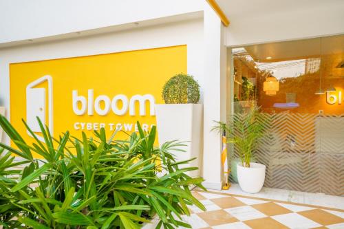 a storefront with plants in front of a store at Bloom Hotel - Cyber Towers in Hyderabad