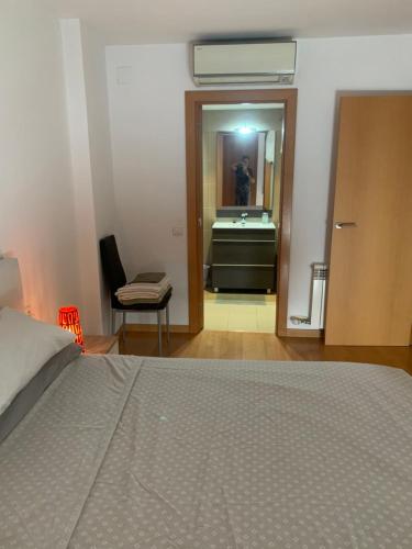 Ένα ή περισσότερα κρεβάτια σε δωμάτιο στο APARTAMENTO construcción nueva BARCELONA - CALELLA