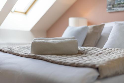 a bed with two towels on top of it at Hotel A4 Wrocław - Bielany in Bielany Wrocławskie