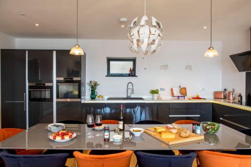 a kitchen with a table with food on it at Fulmar in Torpoint