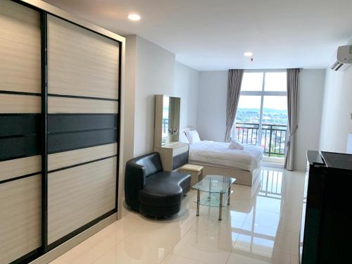 Ένα ή περισσότερα κρεβάτια σε δωμάτιο στο Wiwi Formosa Residence - Kitchen-Balcony-Netflix