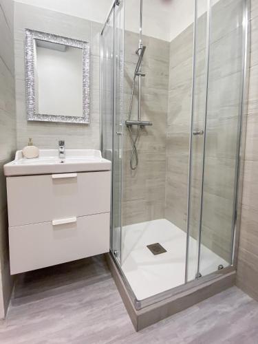 a bathroom with a shower and a sink at Casa Rosmini rooms, Dolomia best home in Trento