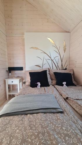 a bedroom with a large bed in a room at Cuda Wianki in Zdów
