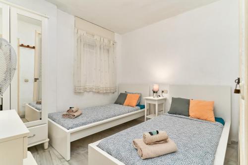 Postel nebo postele na pokoji v ubytování Jardines del Mar