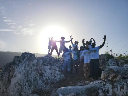 a group of people standing on top of a mountain at Eve's Rockaway Villa in Alligator Pond Village