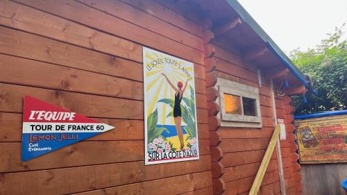 a building with signs on the side of it at Retro Lodge nr Dartoor with hot tub & opt sauna in Newton Abbot