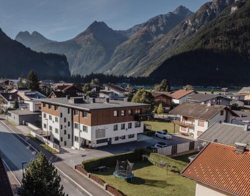 an aerial view of a town with mountains in the background at A Casa Elegance in Längenfeld