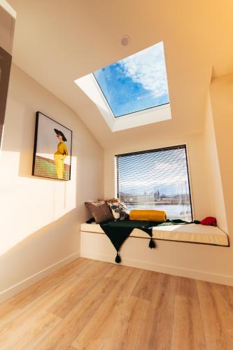 a skylight in a room with a bed and a window at Crescent Moon in Lake Tekapo