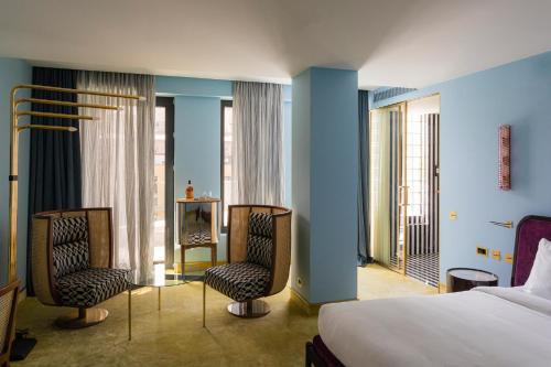 Postel nebo postele na pokoji v ubytování Bazzar Boutique Hotel