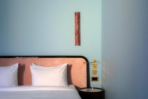 Postel nebo postele na pokoji v ubytování Bazzar Boutique Hotel