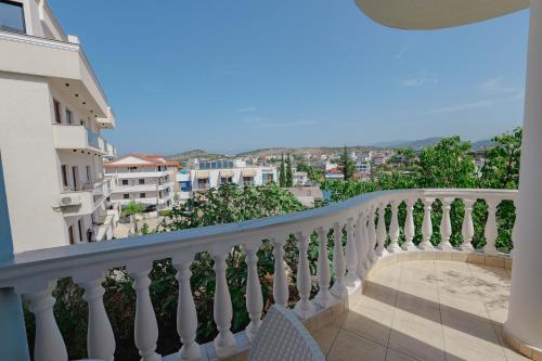 a balcony with a view of a city at Hotel Divo Palace in Ksamil