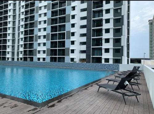 a swimming pool on the roof of a building at D Casa Cattleya Desaru in Kota Tinggi