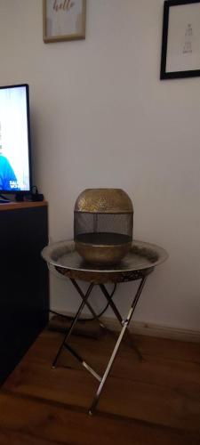 a table with a hat sitting on top of it at Zum Fuchsbau - Schöneiche bei Berlin in Schöneiche