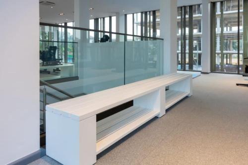 an empty office with a bench in a building at The Lennox Studio @Airport Residential in Accra