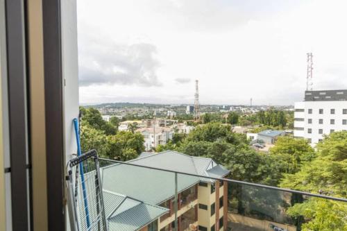 a balcony with a view of a city at The Lennox Studio @Airport Residential in Accra