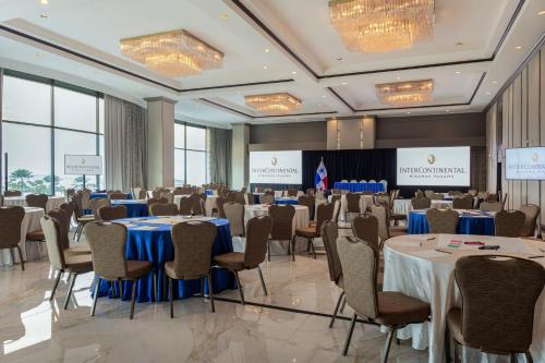 a conference room with tables and chairs and a podium at Intercontinental Miramar Panama by IHG in Panama City