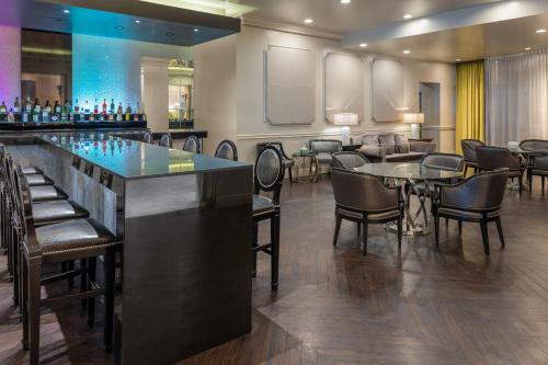 a bar with chairs and tables in a room at Intercontinental Miramar Panama by IHG in Panama City