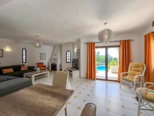 a living room with a couch and a table at V3, Villa Belo Horizonte near Beach, Albufeira in Albufeira