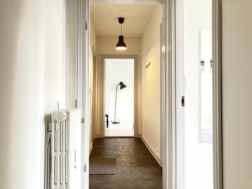 a hallway with a door leading into a room at Three Bedroom Apartment In Kolding, Udsigten 4, in Kolding