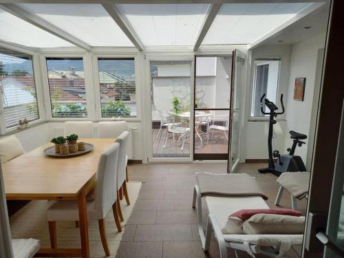 a living room with a table and chairs and a view at Wohnung im Herzen der Altstadt in Schwaz