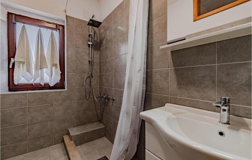 a bathroom with a shower and a sink at 2 Bedroom Nice Apartment In Prigradica in Prigradica