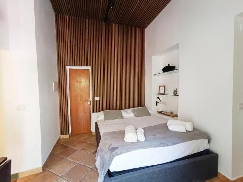 A bed or beds in a room at Mini Studio con Balcone a Piazza del Popolo