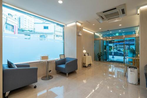 an office with a large window in a building at Pacific7 Hotel in Pyeongtaek