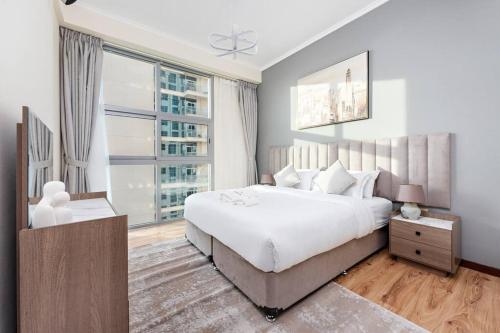 Postel nebo postele na pokoji v ubytování StoneTree - Modern Style 1 BR near Marina Walk