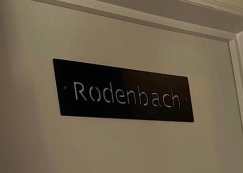 a sign on a wall with the name of a room at Hotel Salvators in Bruges