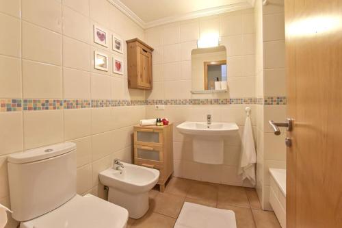 a bathroom with a toilet and a sink at 1BD apartment in lovely Tejita in Granadilla de Abona