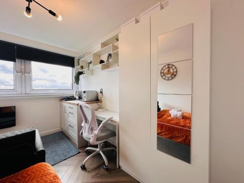a small bedroom with a desk and a bed at Private Room in Modern Shared Apartment, Each with Kitchenette, Central Birmingham in Birmingham