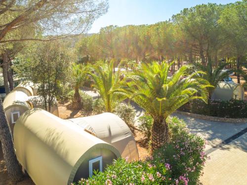 an overhead view of a park with palm trees at Gitavillage Talamone in Talamone