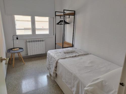Llit o llits en una habitació de Apartament IXA-2