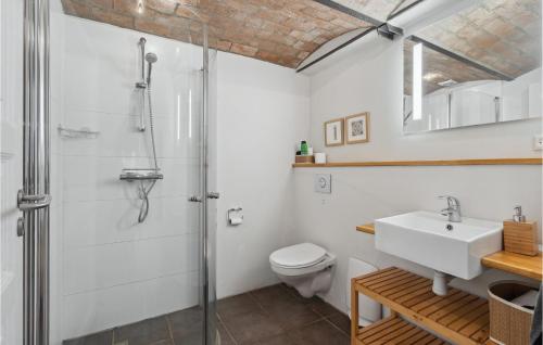 a bathroom with a shower and a sink and a toilet at Amazing Apartment In Ringkbing With Wifi in Ringkøbing