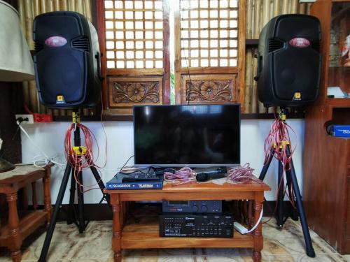 a tv on a table with two video cameras at Josephine's Villa - Bangar, LU (up to 15 guests) in Bangar
