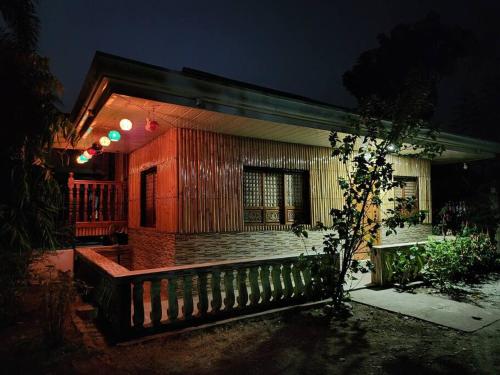 a house with a fence in front of it at night at Josephine's Villa - Bangar, LU (up to 15 guests) in Bangar