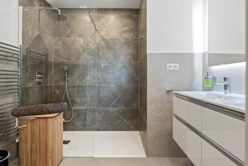 a bathroom with a shower and a sink at Belgravia Club Estepona in Estepona