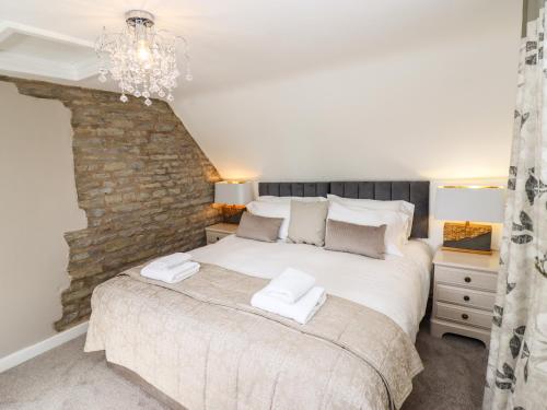 Postel nebo postele na pokoji v ubytování Woodbine Cottage