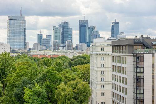 a view of a city skyline with tall buildings at Family Apartment near Old Town by Renters in Warsaw
