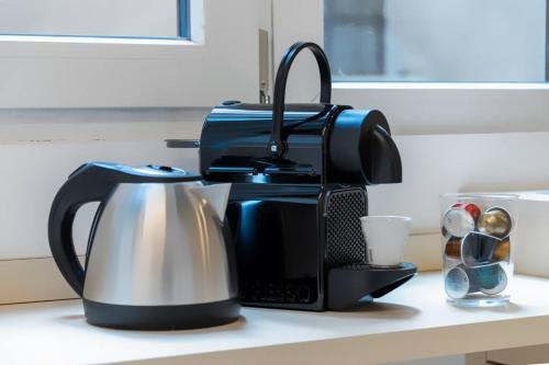 Kemudahan buat kopi dan teh di Duomo's Nest - Central Mini-Apt