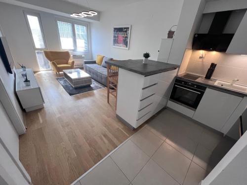 an open kitchen and living room in a apartment at Urban Apartment Skopje in Skopje