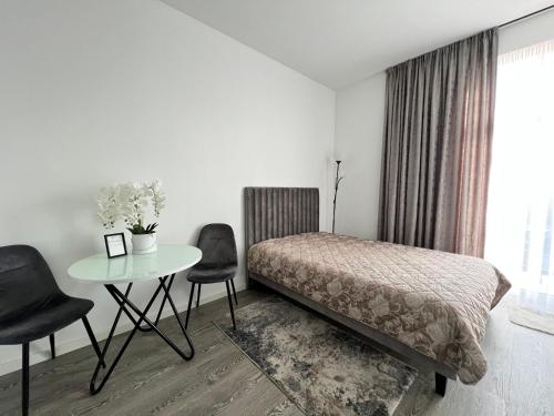 Кровать или кровати в номере Arena apartment