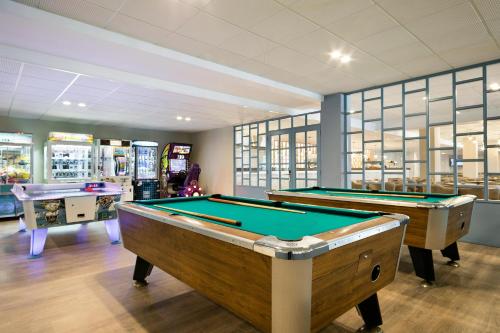 a billiard room with two pool tables in it at Hotel Best Maritim in Cambrils