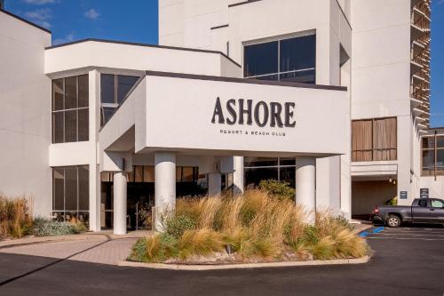 an office building with a sign for a store at Ashore Resort & Beach Club in Ocean City