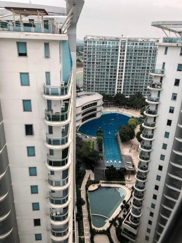 an aerial view of a pool between two buildings at The Crash Pad in Manila